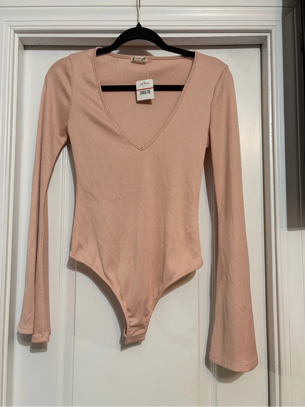 NWT. Free People Charli Ribbed V-Neck Bell Sleeve Bodysuit - Blush